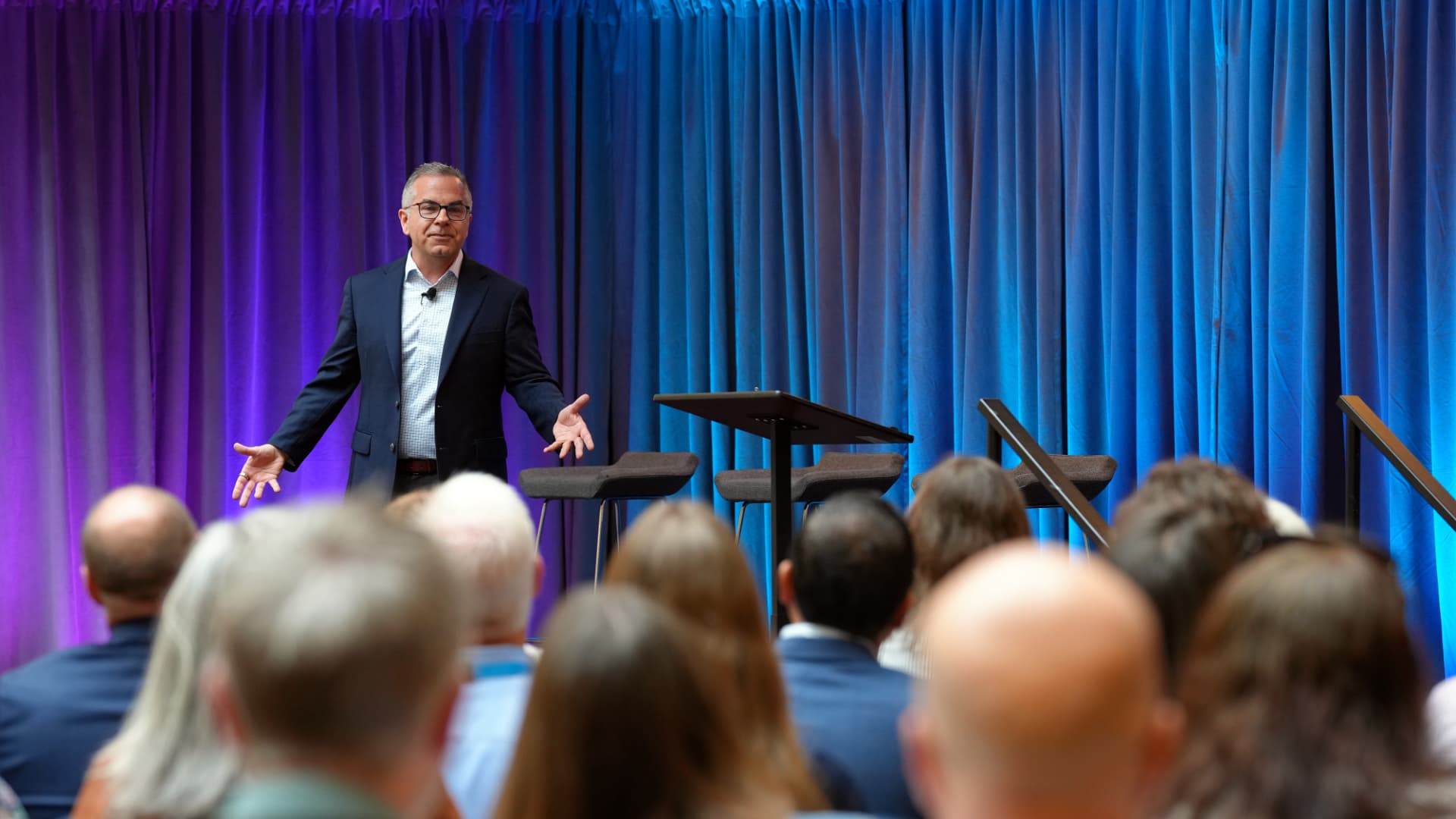 Skip addressing a town hall audience from the stage